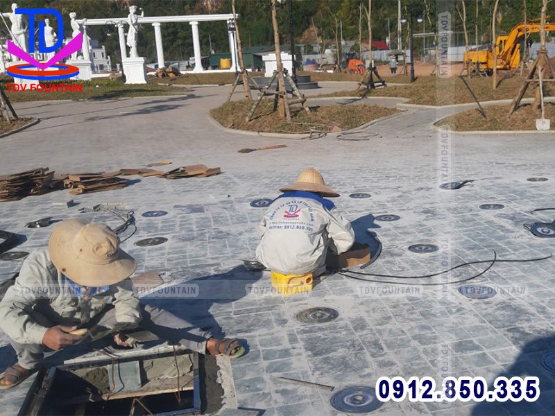Lắp đặt hệ thống đèn âm sàn sân phun nước